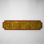 A rectangular sign with indents on each corner. The centre is yellow with the word Fast Track bevelled in, and the border is red.