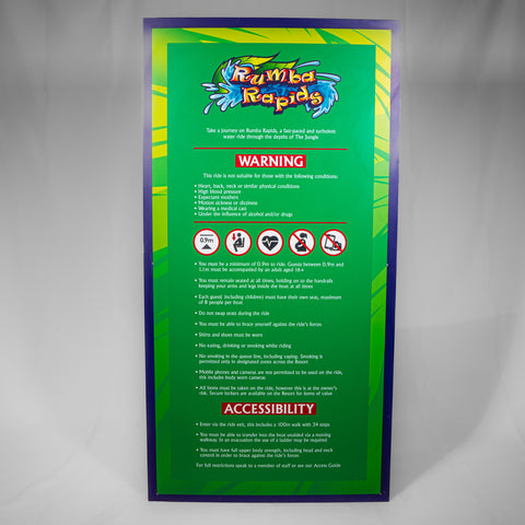 A portrait orientated sign which has the Rumba Rapids logo at the top and a list of ride restrictions underneath. The border is a purple colour and the background is yellow and green