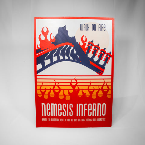 A portrait orientated sign with an image of Nemesis Inferno at the top, some flame patterns below and the words "Nemesis Inferno Brave the blistering heat of one of the uks most intense rollercoasters" in white text on a red background.