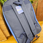 A view of the back of the backpack, showing the straps. The colour is block grey-blue, with orange detailing on the strap adjusters