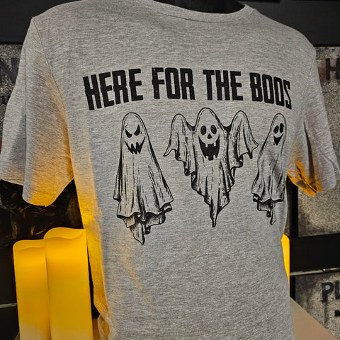 A grey t-shirt with black design of three ghosts, and the phrase "Here for the Boos" above it.