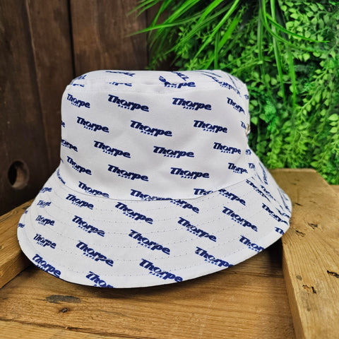 A white bucket hat, with a blue Thorpe Park logo in a repeating pattern all over it.