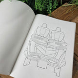 Outline drawing of a Hyperia's train on a piece of paper with plants and wood in the background