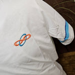 A closer view of the embroidered logo on the chest, it is about 3cm wide and is orange and blue thread.