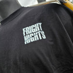 A close up of the printed Fright Nights logo which is a very light grey with hints of pale teal