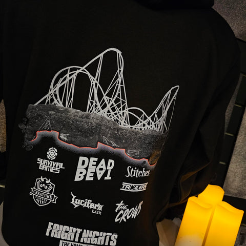 A black hoody with a monochrome design. Hyperia is on top of a rocky outcrop, there is a glowing red line under the rocks and then all of the attraction logos for Fright Nights 2024 in off-white.