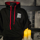 The front of the hoody, it is black with a red lined hood and cord. There is a white Fright Nights logo on the chest pocket.