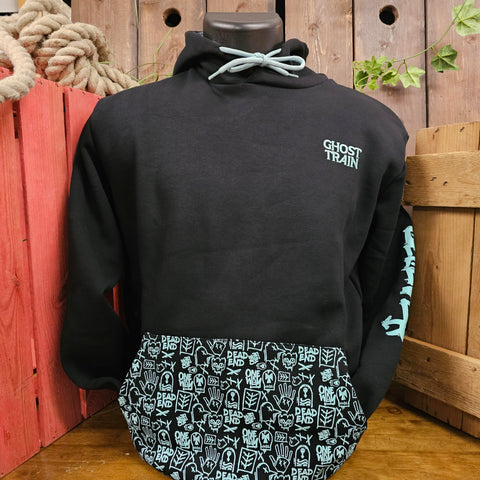 A black hoody with light ice blue printed details on the front pocket. The pocket is printed with runes seen inside the ride, there is a Ghost Train logo embroidered on the chest pocket area, and the world Believer can just be made out on the sleeve
