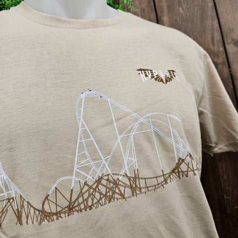 A light sand coloured t-shirt with a small Hyperia logo on the left breast pocket area (it is gold wings with white text), and a white and hold track outline on the centre of the design