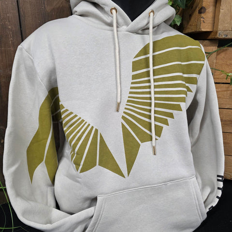 A taupe hoody with a gold set of wings across the chest and arm