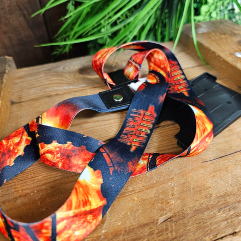 A lanyard with fire graphics and the Nemesis Inferno logo