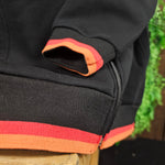 Close up of the wrist and waist detailing, which is black, red and orange stripes.