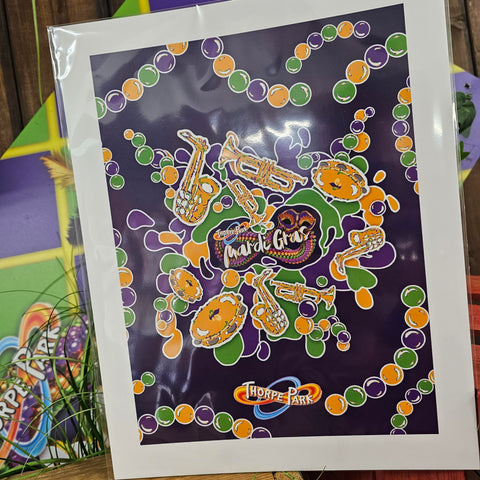 A photograph of some printed artwork of the Mardi Gras jazz imagery. It is purple with a lot of colourful beads and instruments drawn over it!