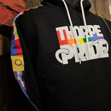 A black hoody with the Thorpe Pride logo printed in the middle. The sleeves have different pride flags down the arms on a stitched on tape.