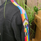 A close up of the flag detailing on the sleeve of the t-shirt 