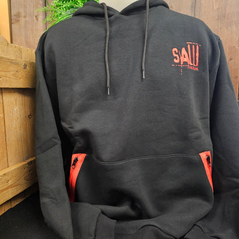A black hoody, with embroidered SAW - The Ride logo on the chest, and red zips on the front pocket
