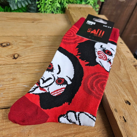 Red socks, with the Billy doll face and dark red spirals and heel details.