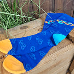The socks unfolded, they are royal blue with the infinity logo on. The heel is light blue and the toes are orange