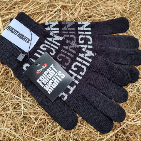 A photograph of some gloves, the base is black and the words Fright Nights are written on them in grey and white text