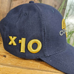 The side of the cap showing gold x10 embroidery