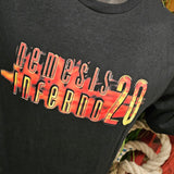 A close up of the printed detail showing the logo in clarity. It is the words Nemesis Inferno 20 on top of a fire style pattern